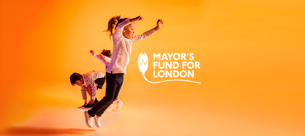 A group of three children are dancing. Two in the background, with one in the foreground jumping in the air. They are against an orange-coloured background. The Mayor's Fund for London logo is sat next to them.