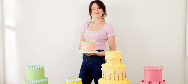 Lily Vanilli poses with colourful Birthday cakes